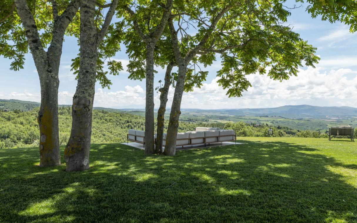 Outdoor lounge in gardens, overlooking lush countryside