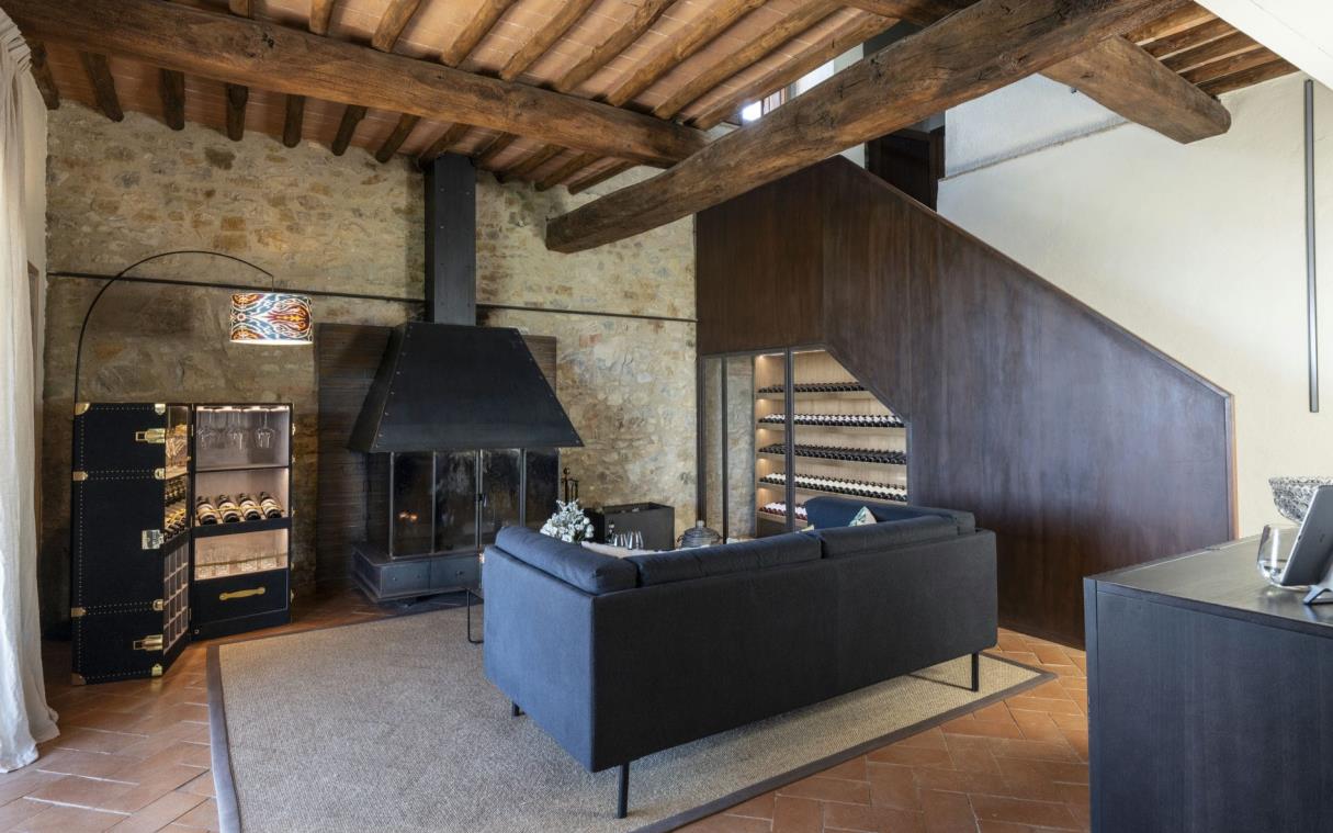 Lounge area with fireplace and wine racks