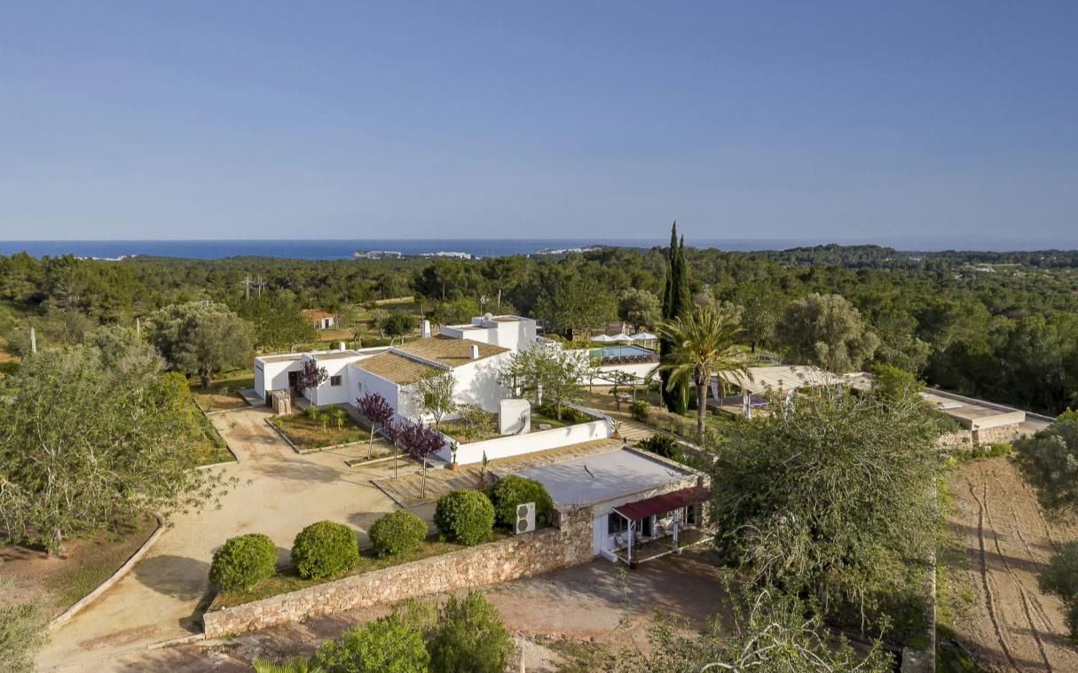 Aerial view of villa with sea views in distance