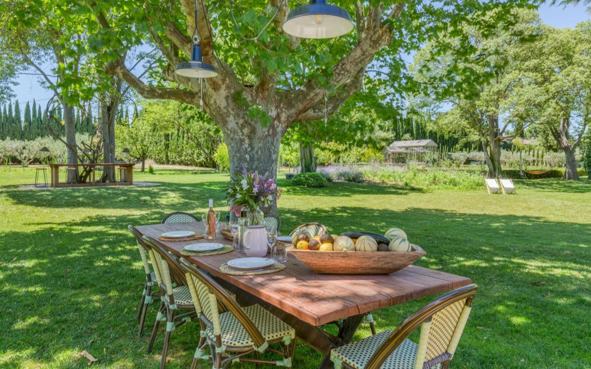 Wooden dining table in garden