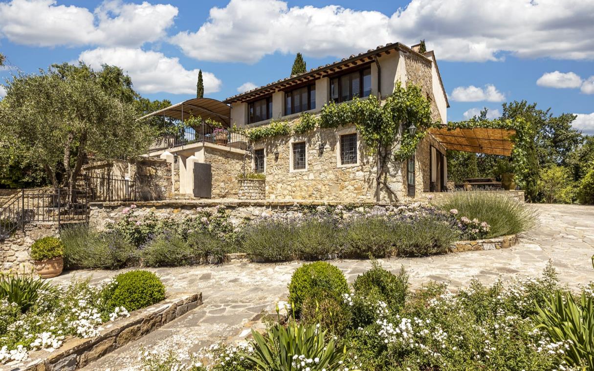 Villa with stone facade and cobbled paths