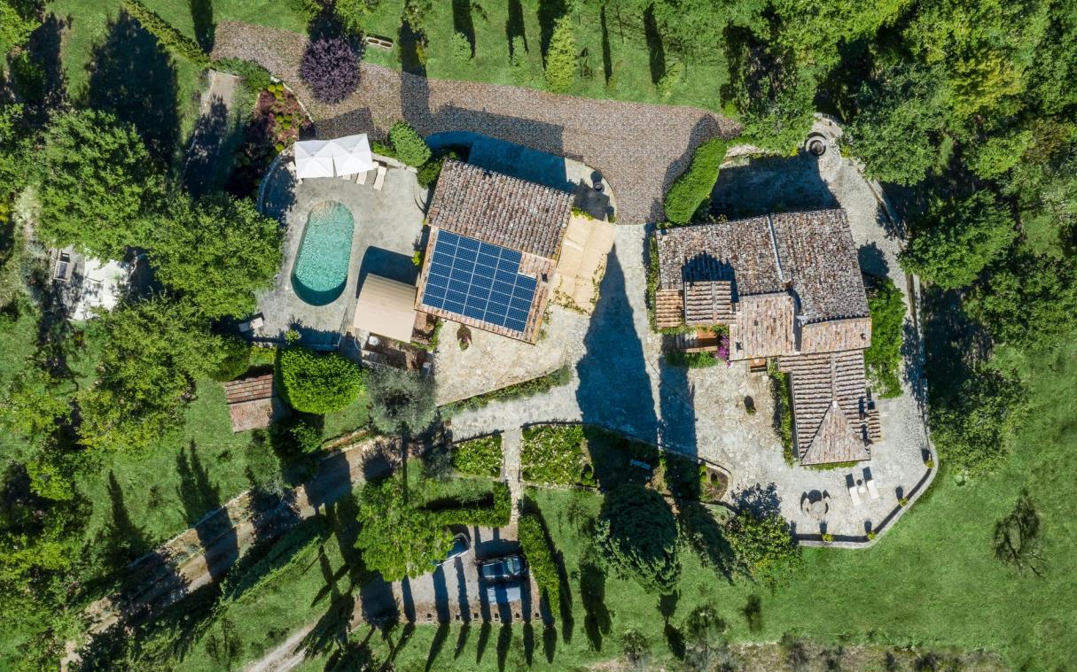 Aerial view of villa surrounded by Tuscan countryside