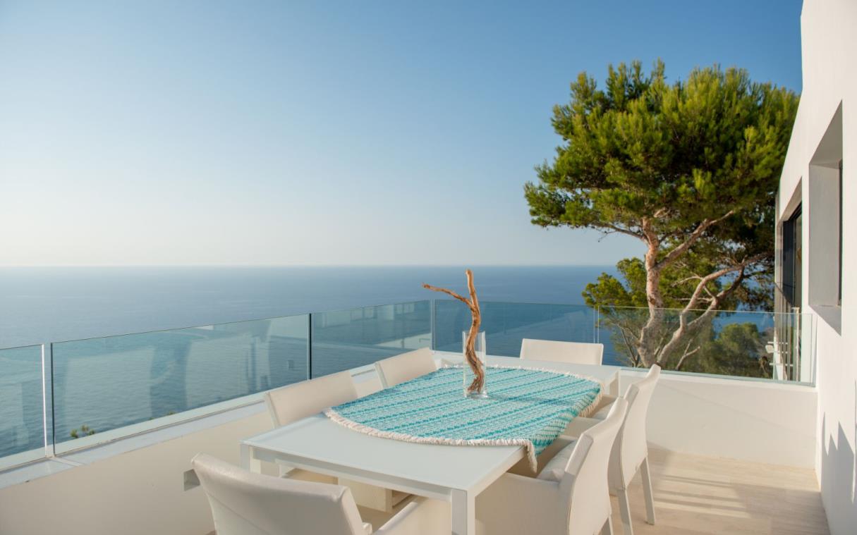 villa-ibiza-balearic-spain-luxury-pool-views-modern-bright-blue-cliff-house-ter (1).jpg