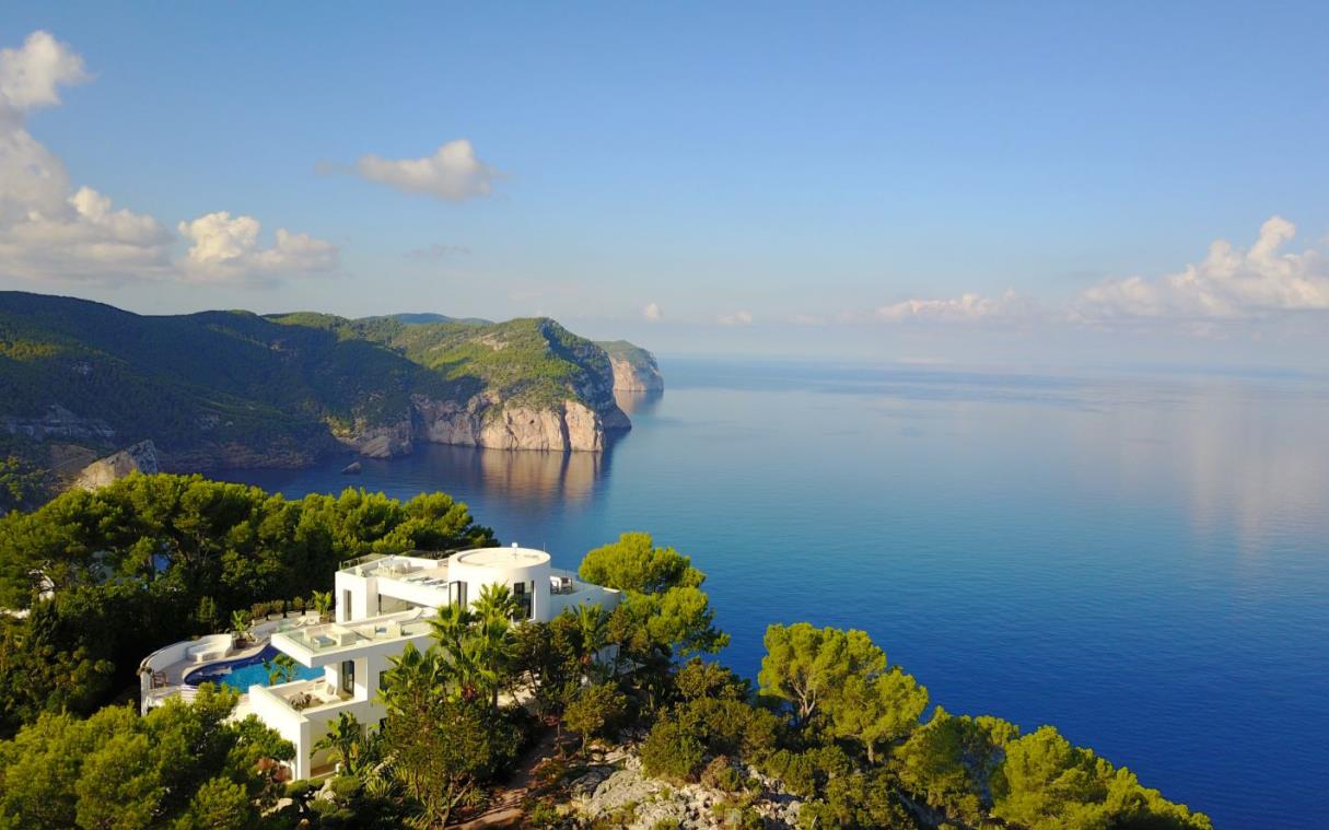 villa-ibiza-balearic-spain-luxury-pool-views-modern-bright-blue-cliff-house-aer (2).jpg