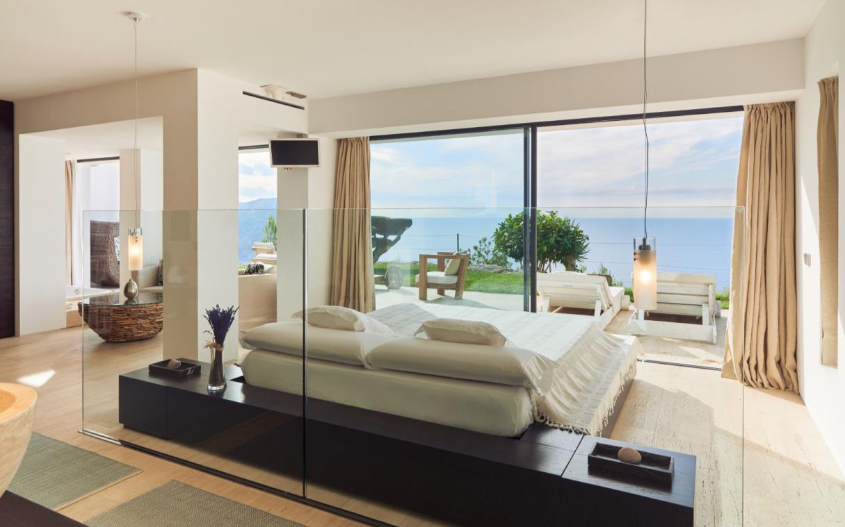 villa-ibiza-balearic-spain-luxury-pool-views-modern-bright-blue-cliff-house-bed (1).jpg