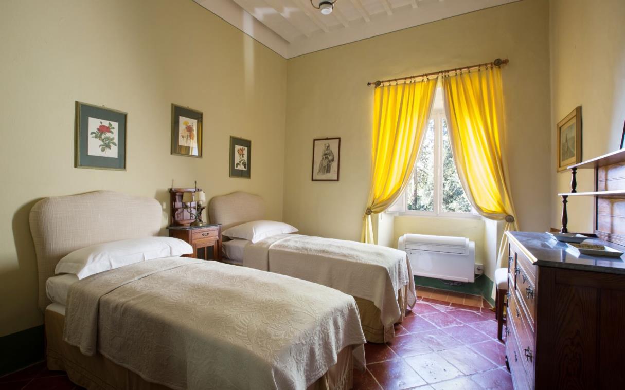 villa-siena-tuscany-italy-luxury-pool-agriturismo-castelnuovo-tancredi-bed-yellow.jpg