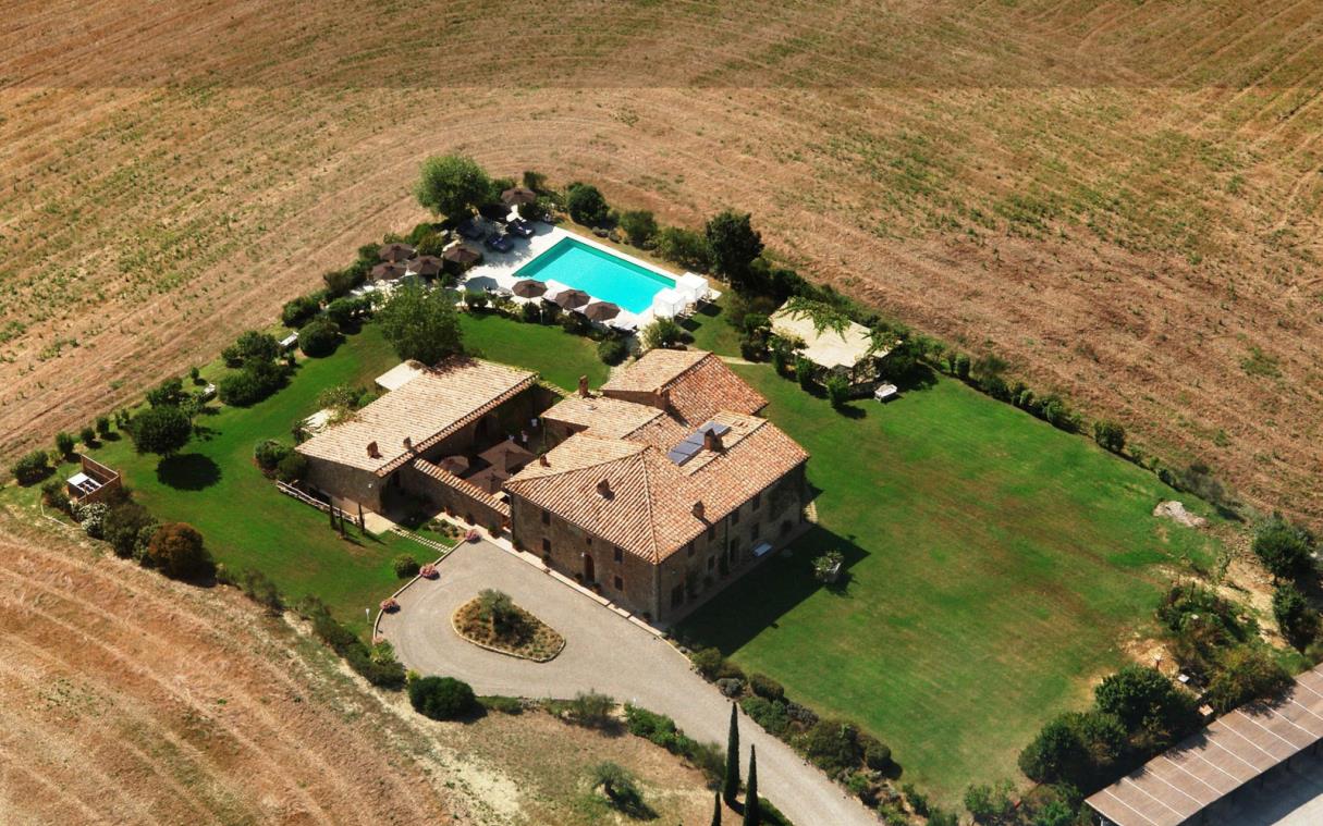villa-pienza-tuscany-val-d'orcia-pool-wine-cellar-luxury-l'olmo-aer-1.jpg