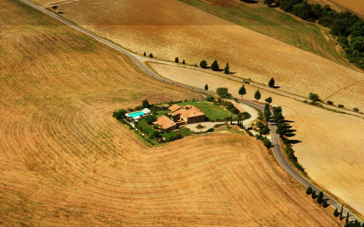villa-pienza-tuscany-val-d'orcia-pool-wine-cellar-luxury-l'olmo-aer-2.jpg