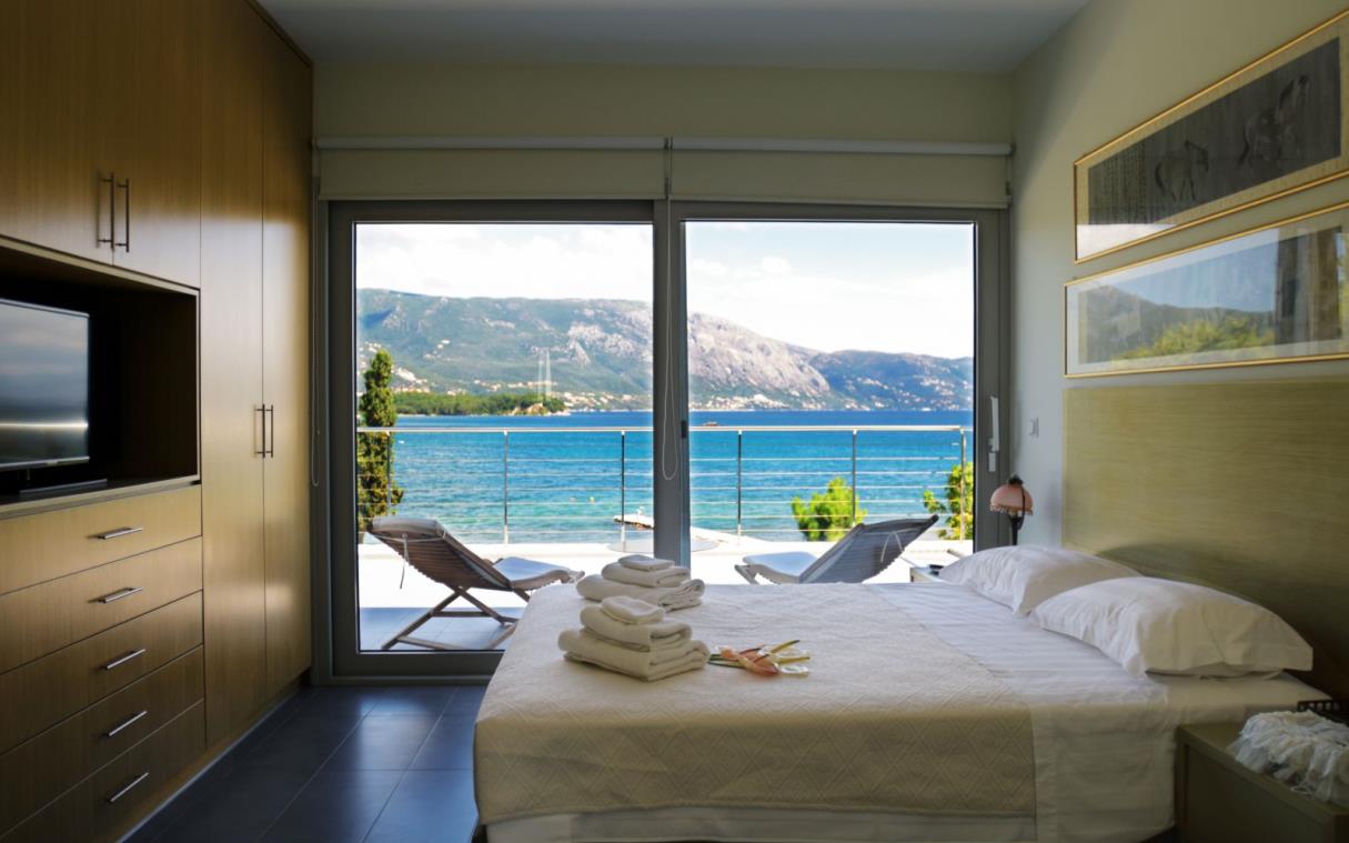 villa-corfu-greek-islands-greece-beachfront-pool-knk-kohyli-bed (2).jpg